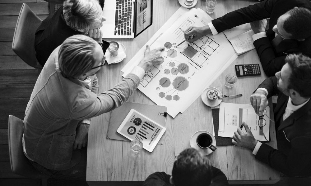 Aerial view of business people brainstorming together
